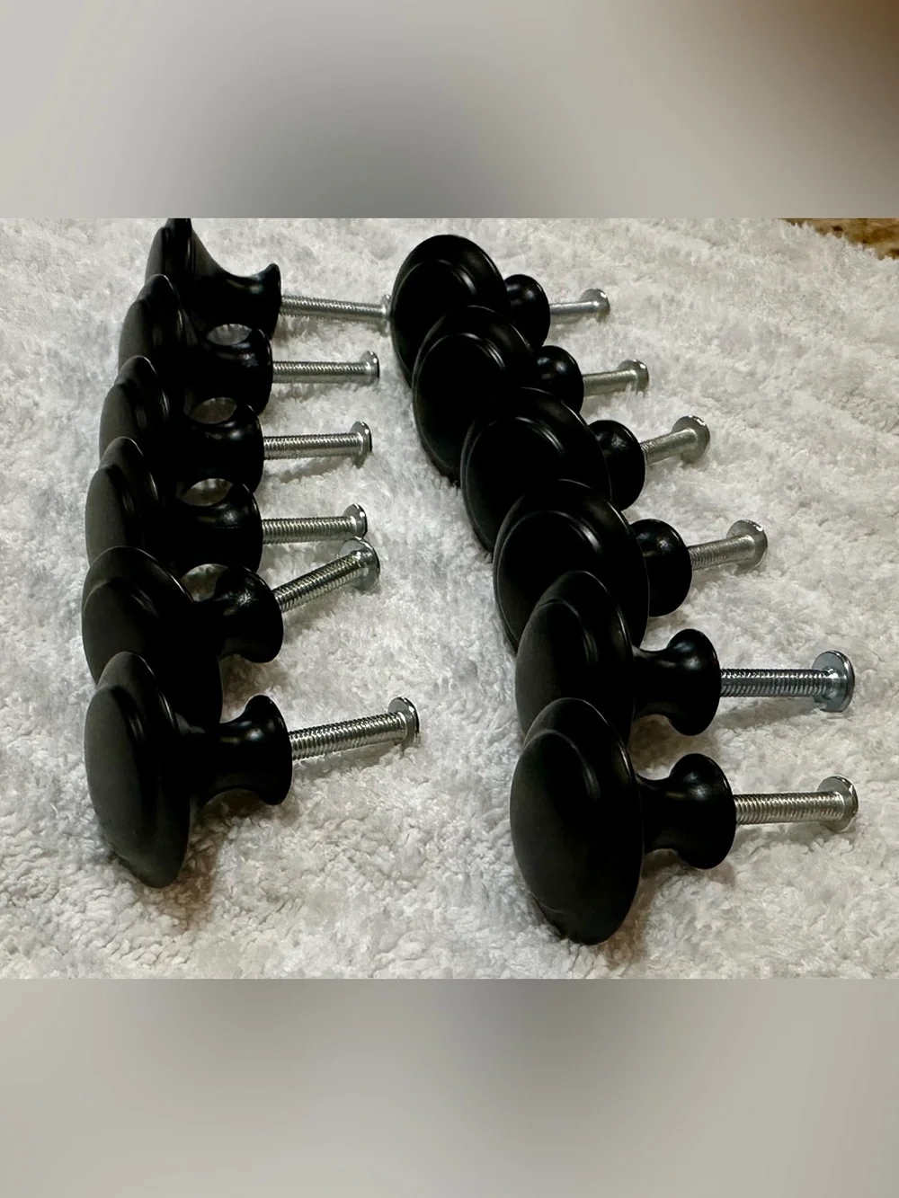 Lot (12) Black cabinet/drawer pulls. Lightweight includes screws.